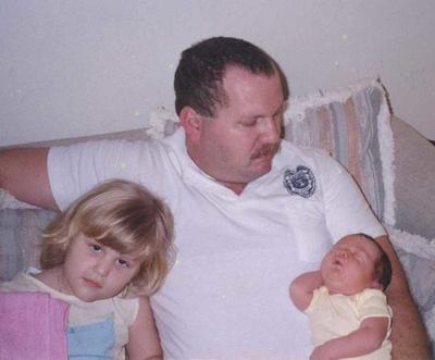 Officer Stafford and his two young daughters